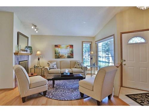 247 Hamptons Park Nw, Calgary, AB - Indoor Photo Showing Living Room With Fireplace