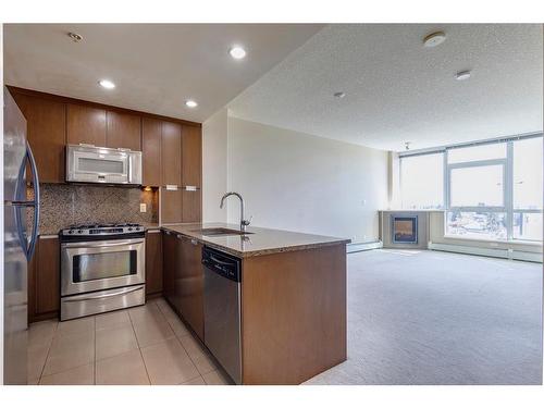 604-99 Spruce Place Sw, Calgary, AB - Indoor Photo Showing Kitchen With Upgraded Kitchen