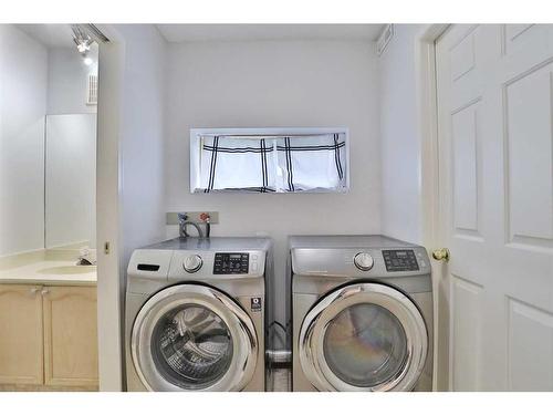 205 Coachway Lane Sw, Calgary, AB - Indoor Photo Showing Laundry Room