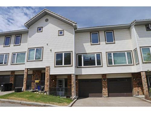 205 Coachway Lane Sw, Calgary, AB - Outdoor With Facade