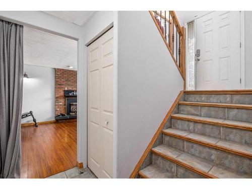 6360 Pineridge Road Ne, Calgary, AB - Indoor Photo Showing Other Room With Fireplace