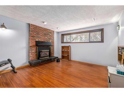6360 Pineridge Road Ne, Calgary, AB - Indoor Photo Showing Living Room With Fireplace