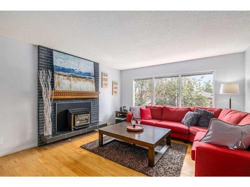 6360 Pineridge Road Ne, Calgary, AB - Indoor Photo Showing Living Room With Fireplace