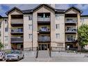 8423-304 Mackenzie Way Sw, Airdrie, AB  - Outdoor With Balcony With Facade 