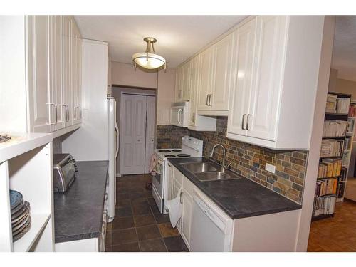 224-1616 8 Avenue Nw, Calgary, AB - Indoor Photo Showing Kitchen With Double Sink