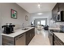 23 Nolancrest Gate Nw, Calgary, AB  - Indoor Photo Showing Kitchen With Double Sink 