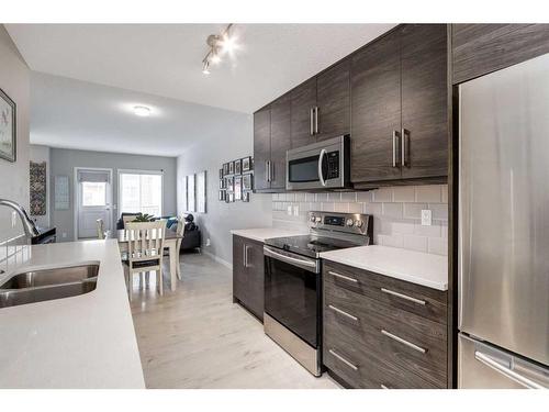 23 Nolancrest Gate Nw, Calgary, AB - Indoor Photo Showing Kitchen With Double Sink