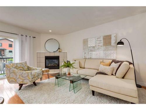 2-2036 27 Avenue Sw, Calgary, AB - Indoor Photo Showing Living Room With Fireplace