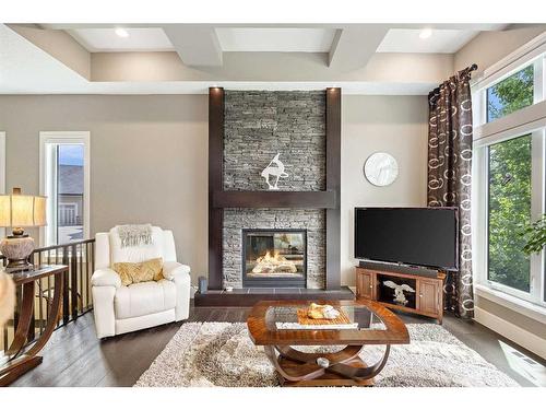 69 Waters Edge Drive, Heritage Pointe, AB - Indoor Photo Showing Living Room With Fireplace