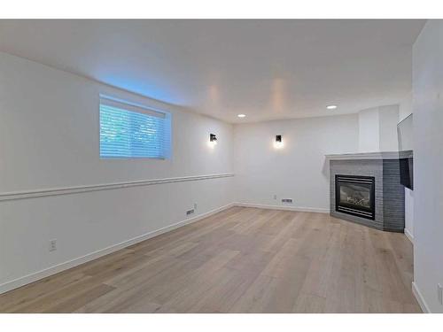 16 Galway Crescent Sw, Calgary, AB - Indoor With Fireplace