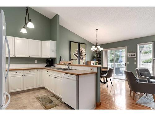 300 De Foras Close Nw, High River, AB - Indoor Photo Showing Kitchen With Double Sink