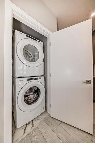2301-681 Savanna Boulevard Ne, Calgary, AB - Indoor Photo Showing Laundry Room