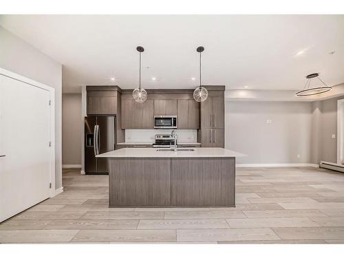 2301-681 Savanna Boulevard Ne, Calgary, AB - Indoor Photo Showing Kitchen