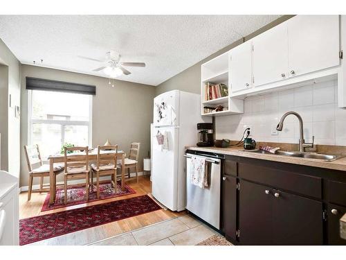 7-1615 Mcgonigal Drive Ne, Calgary, AB - Indoor Photo Showing Kitchen With Double Sink