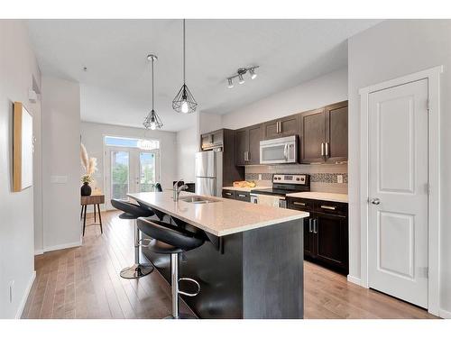 118 Legacy Boulevard Se, Calgary, AB - Indoor Photo Showing Kitchen With Double Sink With Upgraded Kitchen