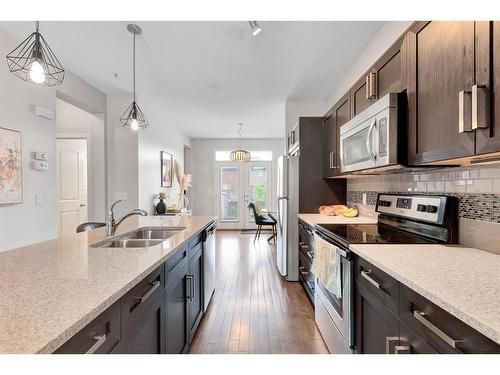 118 Legacy Boulevard Se, Calgary, AB - Indoor Photo Showing Kitchen With Double Sink With Upgraded Kitchen