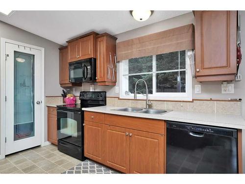 5224 Township Road 292, Rural Mountain View County, AB - Indoor Photo Showing Kitchen With Double Sink