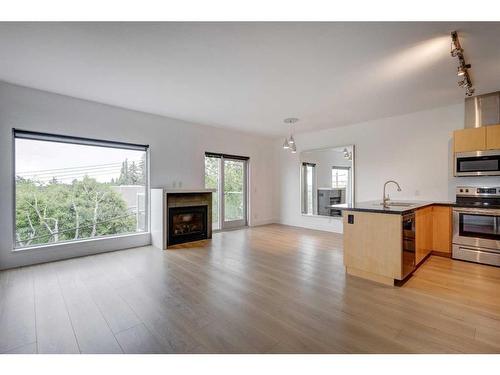 202-2124 17 Street Sw, Calgary, AB - Indoor With Fireplace