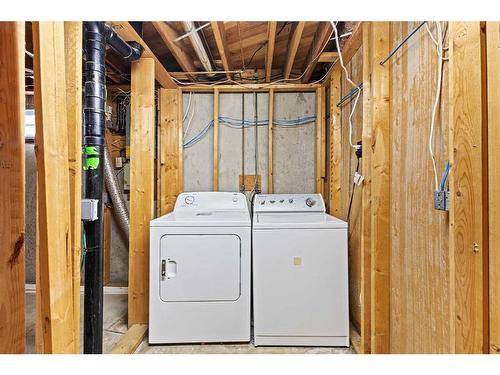 452 Queen Alexandra Way Se, Calgary, AB - Indoor Photo Showing Laundry Room