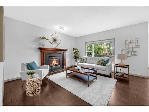 118 Aspen Hills Drive Sw, Calgary, AB - Indoor Photo Showing Living Room With Fireplace