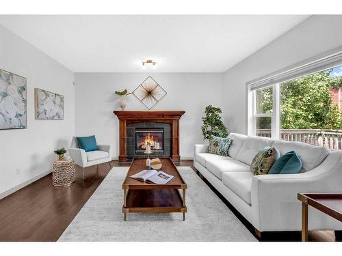 118 Aspen Hills Drive Sw, Calgary, AB - Indoor Photo Showing Living Room With Fireplace