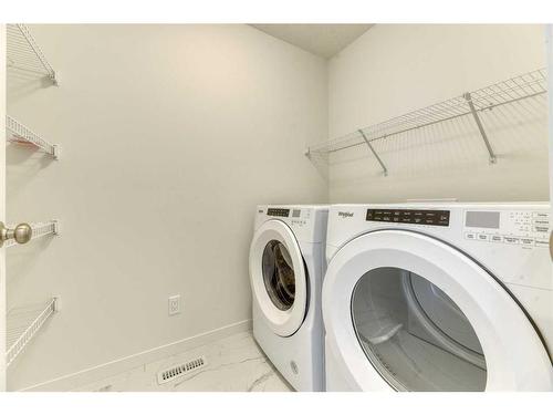 67 Arbour Lake Heights Nw, Calgary, AB - Indoor Photo Showing Laundry Room