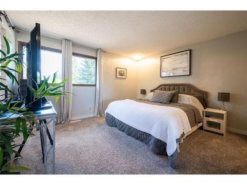 347 Woodpark Place Sw, Calgary, AB - Indoor Photo Showing Bedroom