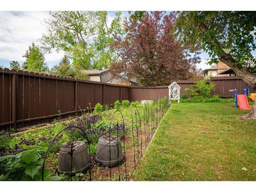 347 Woodpark Place Sw, Calgary, AB - Outdoor With Backyard