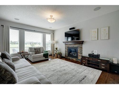 119 Brightoncrest Terrace Se, Calgary, AB - Indoor Photo Showing Living Room With Fireplace