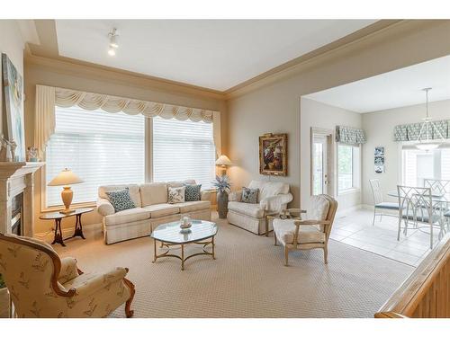 9 Simcoe Gate Sw, Calgary, AB - Indoor Photo Showing Living Room With Fireplace