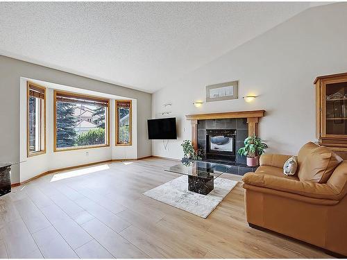 522 Hawkside Mews Nw, Calgary, AB - Indoor Photo Showing Living Room With Fireplace