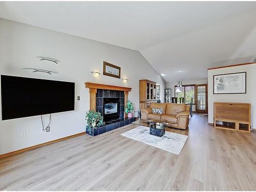 522 Hawkside Mews Nw, Calgary, AB - Indoor Photo Showing Living Room With Fireplace