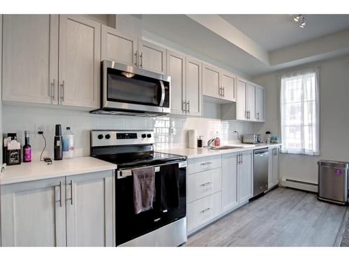 5211-151 Legacy Main Street Se, Calgary, AB - Indoor Photo Showing Kitchen