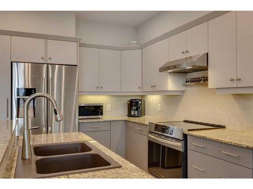 2307-10221 Tuscany Boulevard Nw, Calgary, AB - Indoor Photo Showing Kitchen With Double Sink With Upgraded Kitchen