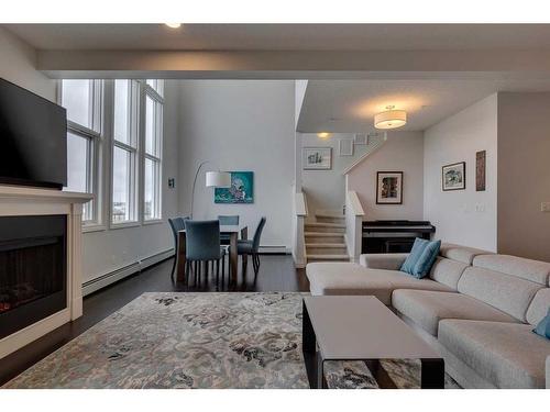 2307-10221 Tuscany Boulevard Nw, Calgary, AB - Indoor Photo Showing Living Room With Fireplace