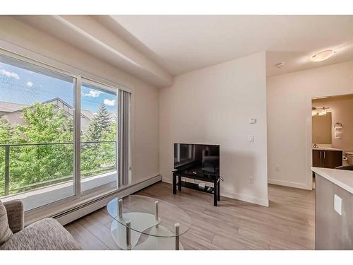 209-15233 1 Street Se, Calgary, AB - Indoor Photo Showing Living Room