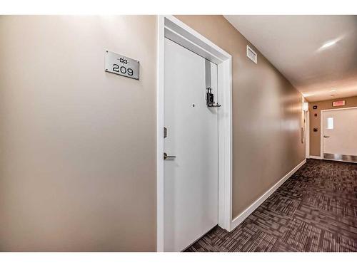 209-15233 1 Street Se, Calgary, AB - Indoor Photo Showing Other Room