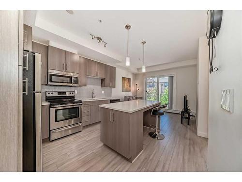 209-15233 1 Street Se, Calgary, AB - Indoor Photo Showing Kitchen With Upgraded Kitchen