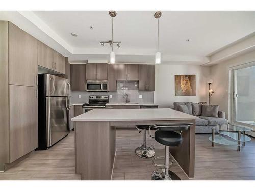 209-15233 1 Street Se, Calgary, AB - Indoor Photo Showing Kitchen With Upgraded Kitchen