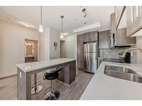 209-15233 1 Street Se, Calgary, AB - Indoor Photo Showing Kitchen With Double Sink With Upgraded Kitchen
