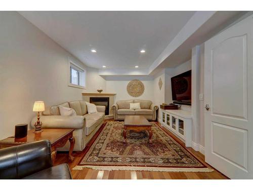 109 Shawnee Place Sw, Calgary, AB - Indoor Photo Showing Other Room With Fireplace