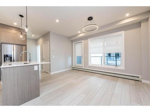 2207-681 Savanna Boulevard Ne, Calgary, AB - Indoor Photo Showing Kitchen With Upgraded Kitchen