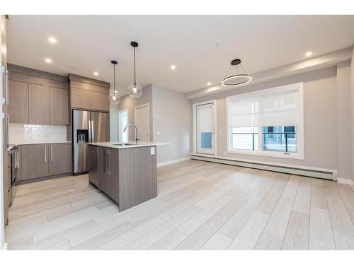 2207-681 Savanna Boulevard Ne, Calgary, AB - Indoor Photo Showing Kitchen With Stainless Steel Kitchen With Upgraded Kitchen