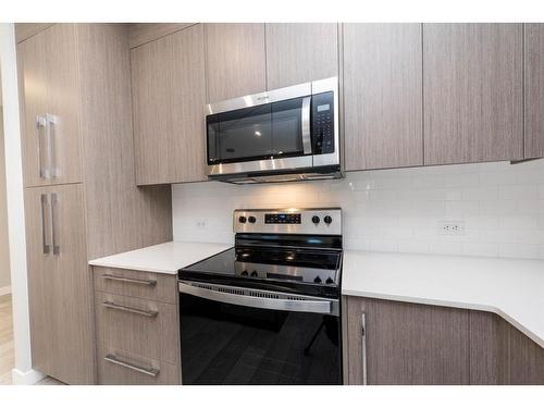 2207-681 Savanna Boulevard Ne, Calgary, AB - Indoor Photo Showing Kitchen