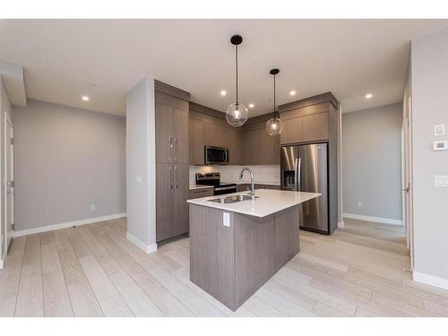 2207-681 Savanna Boulevard Ne, Calgary, AB - Indoor Photo Showing Kitchen With Stainless Steel Kitchen