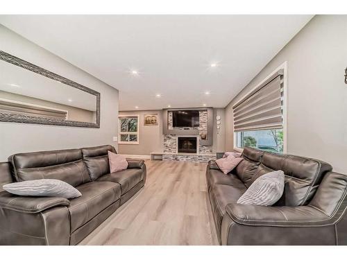 16 Rundlewood Bay Ne, Calgary, AB - Indoor Photo Showing Living Room With Fireplace