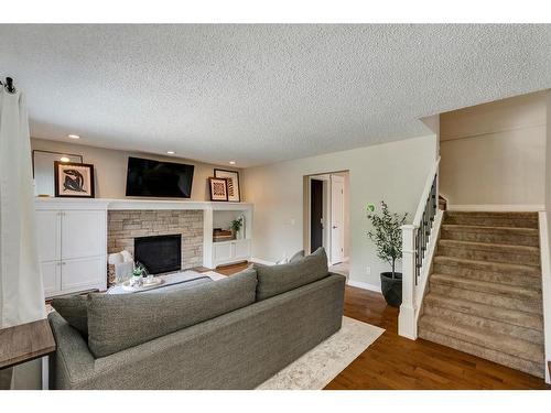 163 Macewan Ridge Close Nw, Calgary, AB - Indoor Photo Showing Living Room With Fireplace