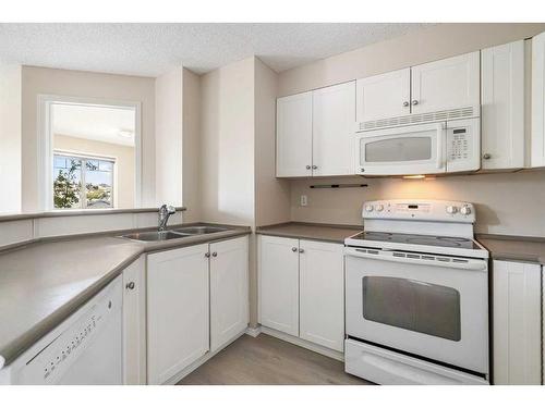 4306-60 Panatella Street Nw, Calgary, AB - Indoor Photo Showing Kitchen With Double Sink