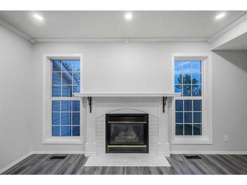 1128 Country Hills Circle Nw, Calgary, AB - Indoor Photo Showing Living Room With Fireplace