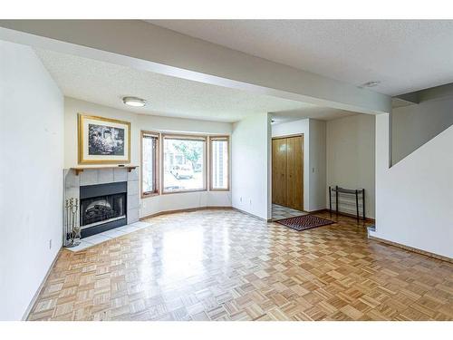 113 Cedarwood Park Sw, Calgary, AB - Indoor With Fireplace